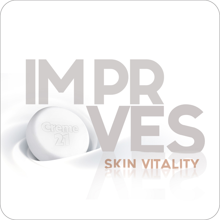 Creme 21 skincare advertisement showing white product container with "IMPROVES SKIN VITALITY" text overlay.