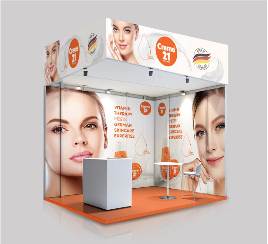 Creme 21 trade show booth displaying "Vitamin Therapy meets German Skincare Expertise" with product displays.