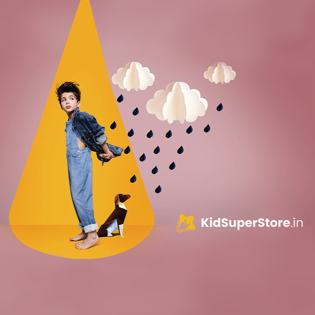KidSuperStore.in creative advertisement with child in denim, yellow umbrella shape, clouds and rain on pink background.