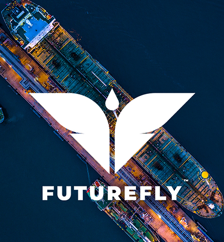 White Futurefly logo with stylized wings over an aerial nighttime view of a large cargo ship and water.