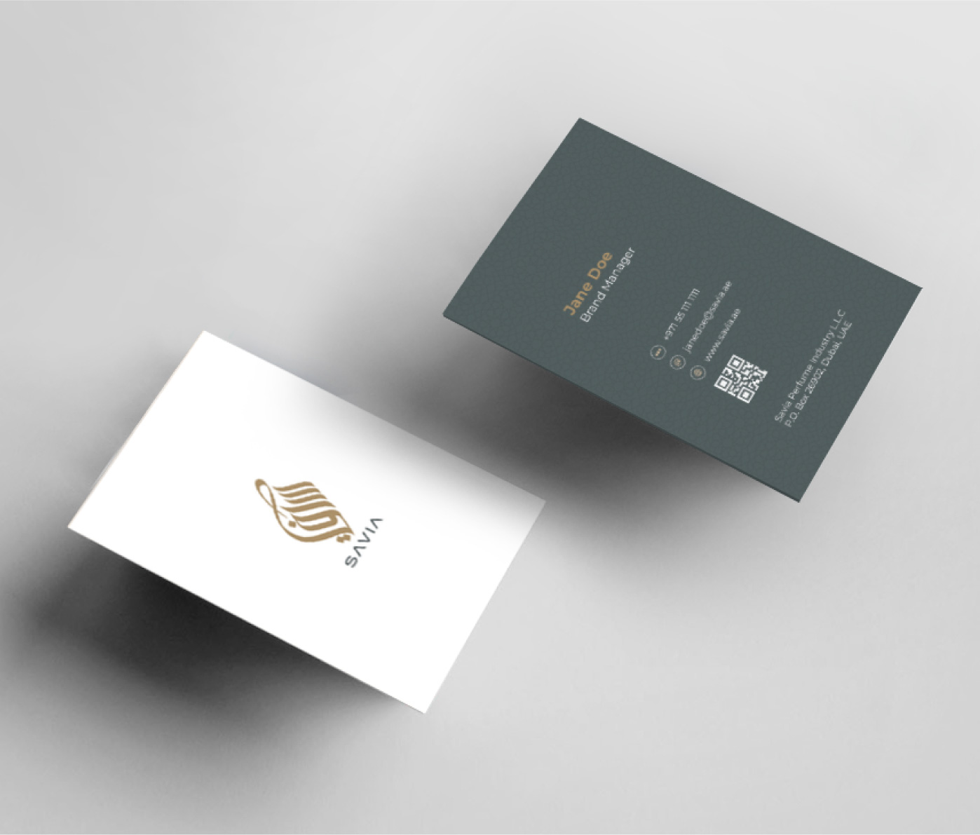 SAVIA business card mockup featuring white front with gold logo and dark green back with contact details.