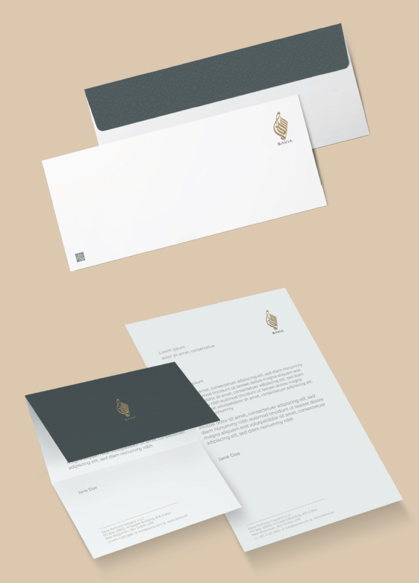 SAVIA corporate stationery set including letterhead, business card, and envelope with green and gold branding.