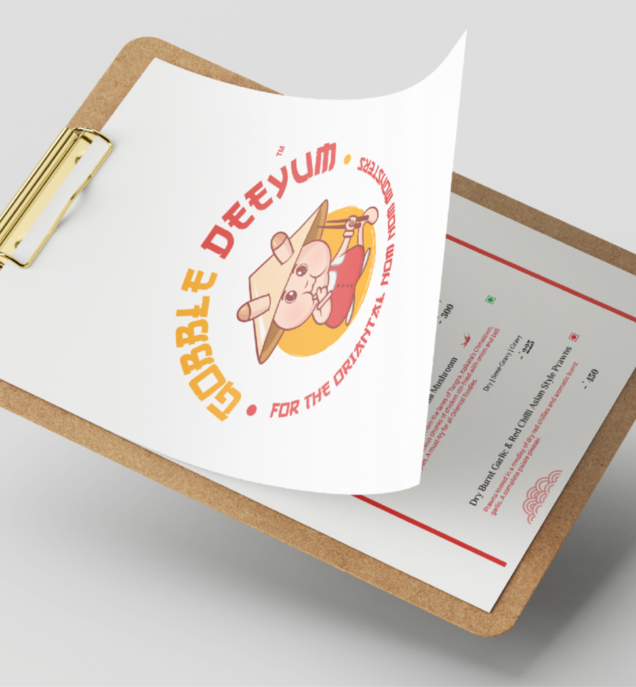A clipboard holds a menu with a cute cartoon character and the text "Gobble Deeyum - For the Oriental Mom Monsters."