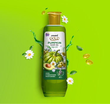 Emami Gold Pumpkin Hair Oil bottle with pumpkin, olive, and daisy flower graphics on a vibrant green background.