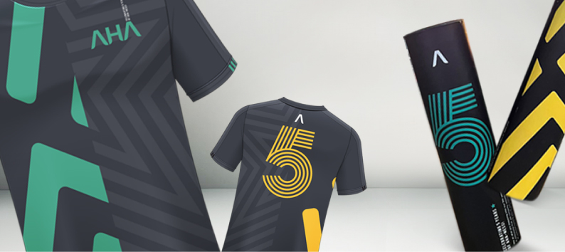 Front and back of dark AHA sports jerseys with geometric patterns, green accents, and bold yellow number 5, plus matching tube packaging.