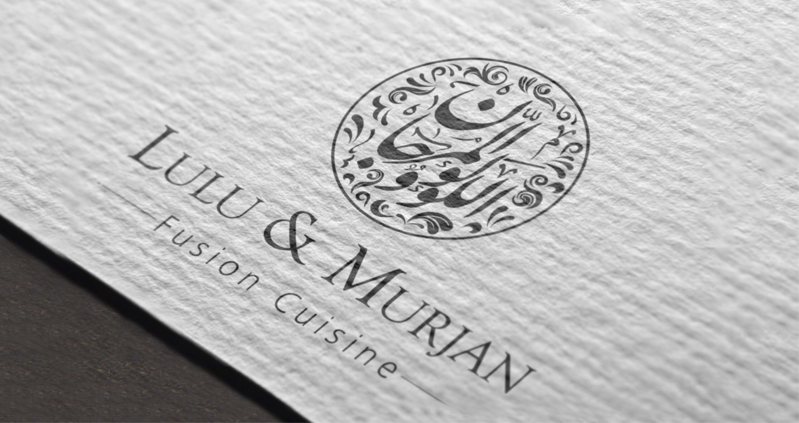 Elegant Lulu & Murjan Fusion Cuisine logo with intricate Arabic calligraphy in a circular design on textured white paper.