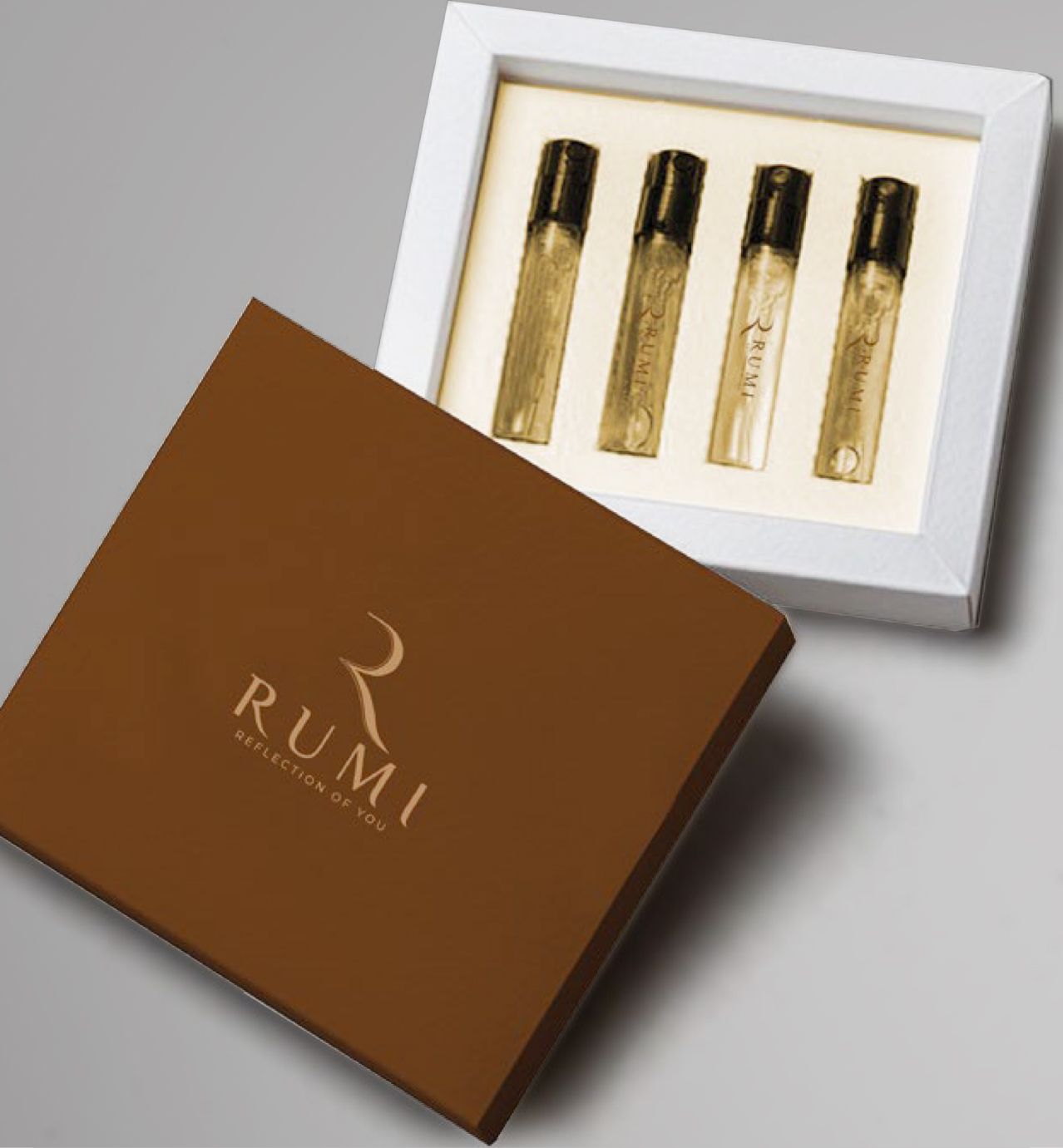 Brown RUMI box labeled "Reflection of You" with four small perfume vials displayed in a white tray.