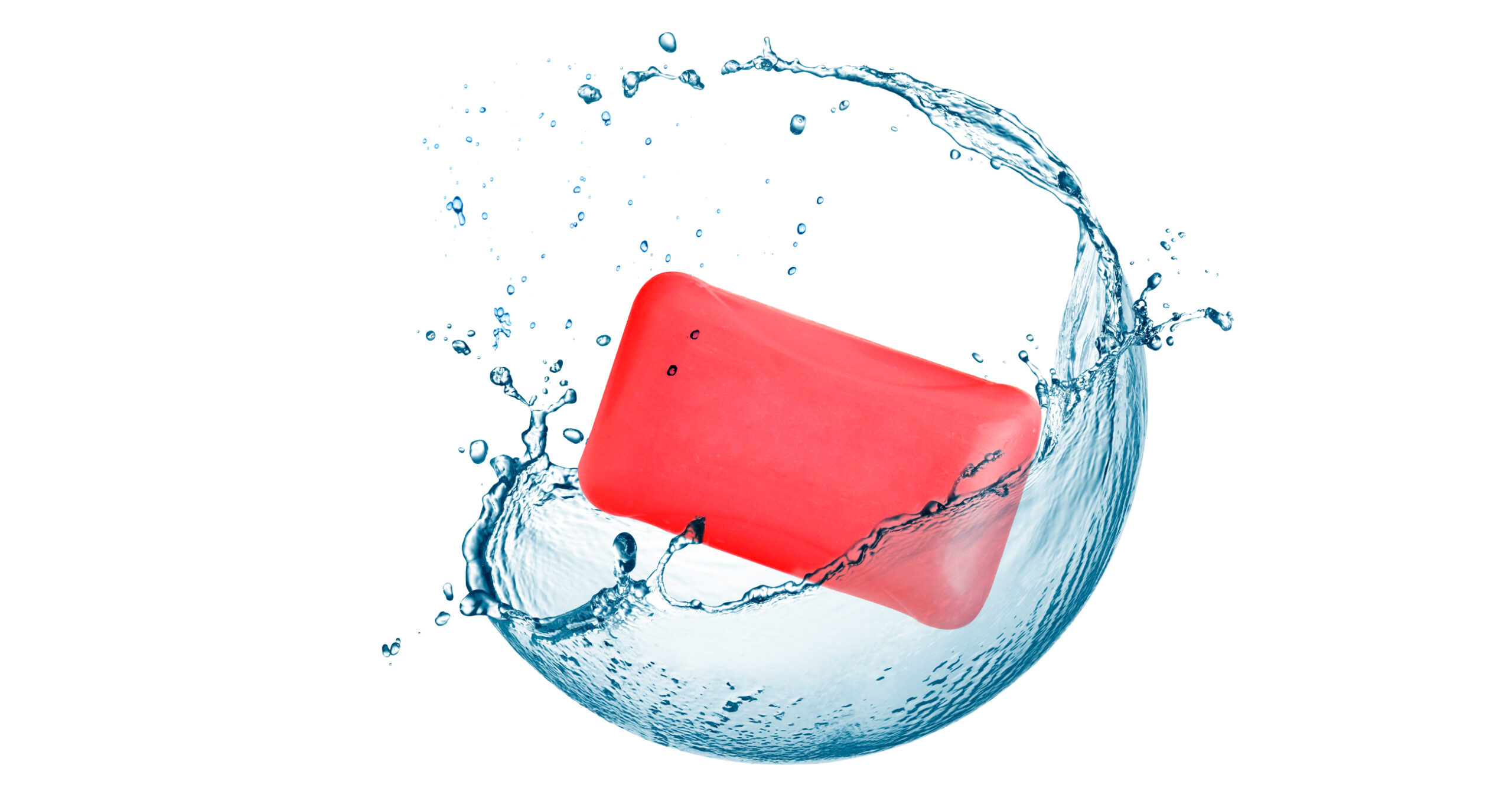 A red bar of soap splashes through clear blue water against a plain white background.