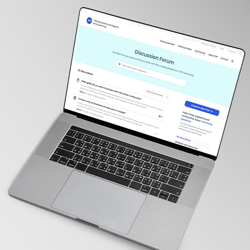 Laptop displaying an online discussion forum webpage with posts and search features on the screen.