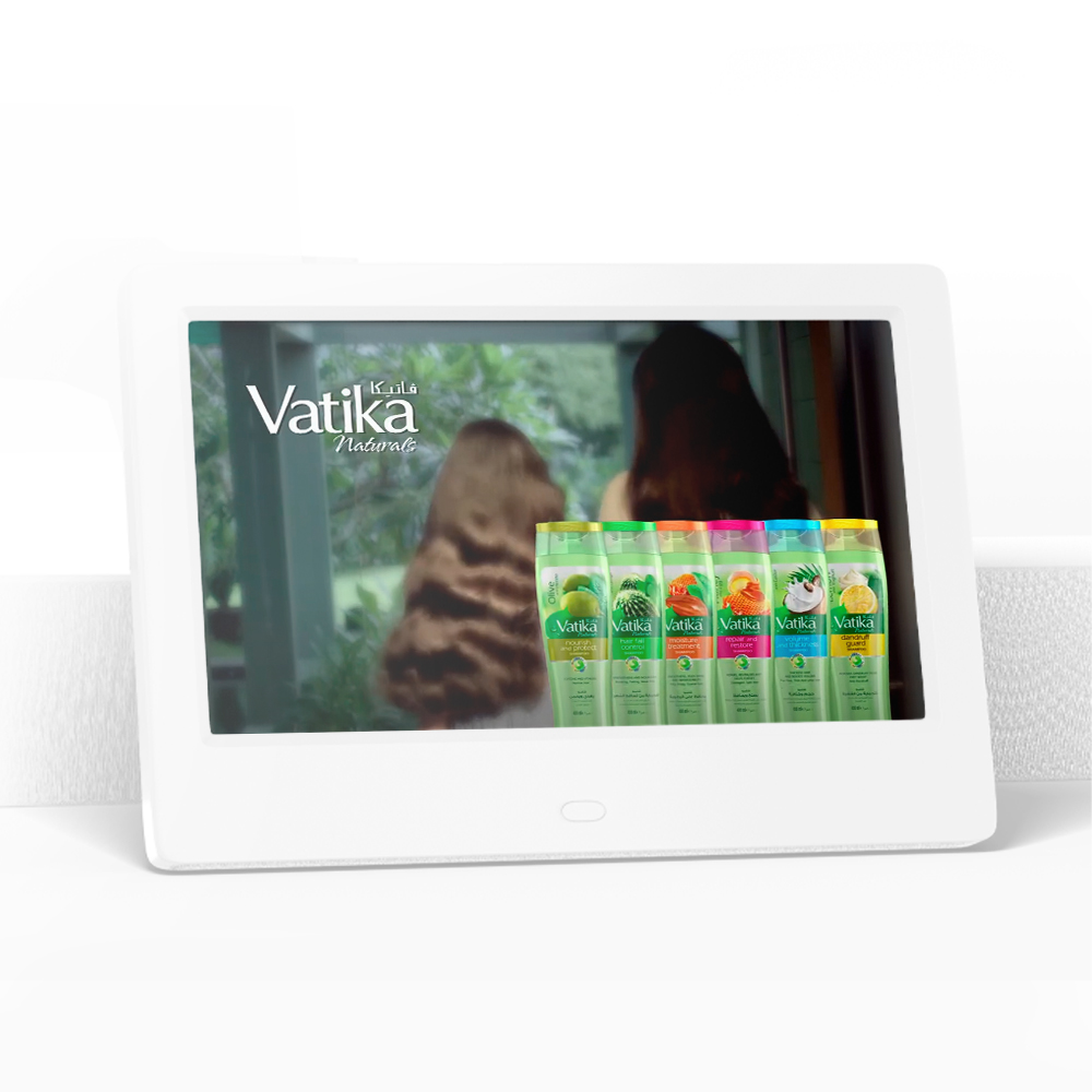 Vatika Naturals ad displayed on a white screen, showing two women with long hair and various Vatika shampoo bottles in front.