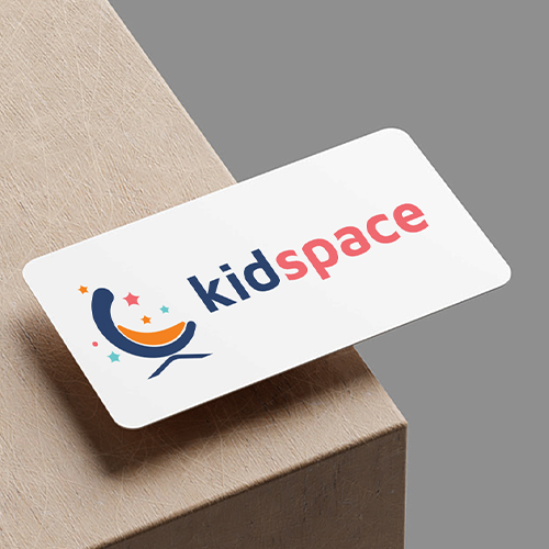 A business card displays kidspace logo with playful icons and colorful stars on a neutral background.