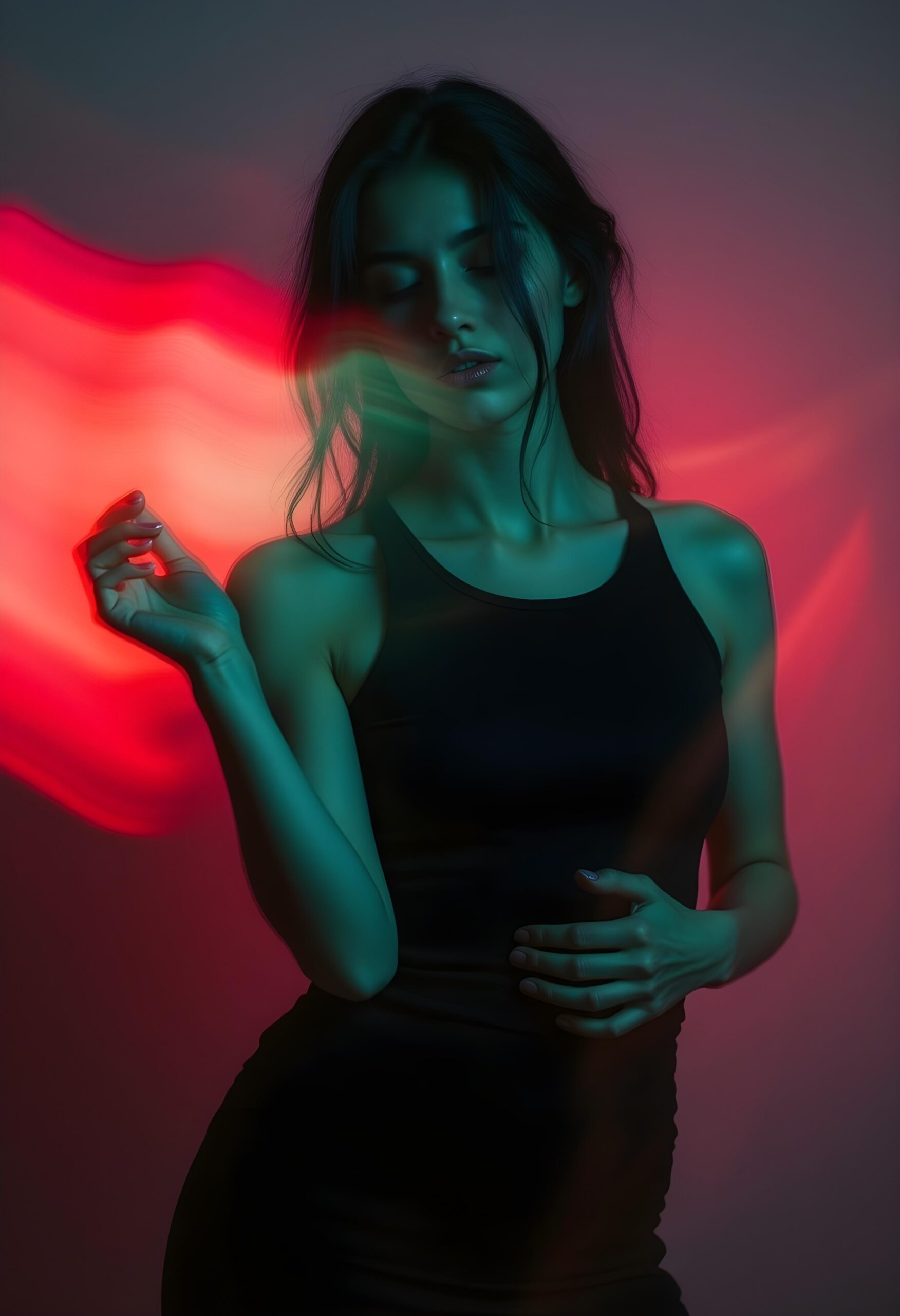 A woman standing in dramatic pink and green lighting, representing the emotional power of sound.